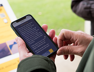 Close up of a smartphone user's hands operating a smartphone.