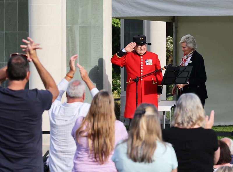 Chelsea pensioner Colin Thackrey salutes the crowd at An Evening at Brookwood 2024.