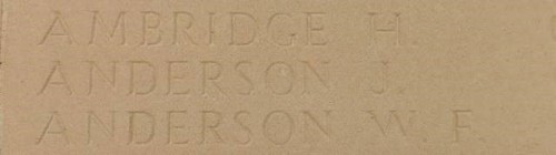 Close up of the name Anderson J. carved into a limestone panel.