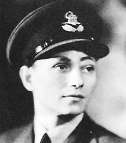 Black and white portrait of Wing Commander Hugh Malcolm VC in his pilot's uniform.