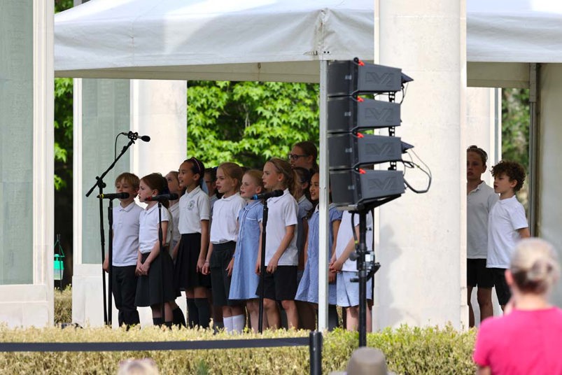 A chorus of schoolchildren performing on the rotunda at Brookwood Military Cemetery.