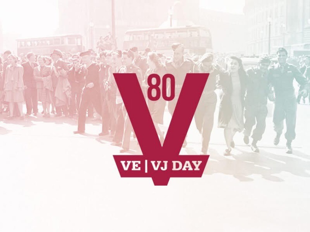 Image shows a scarlet central V logo with the numerals 80 overlaid in the gap of the V and VE | VJ Day text across the point. A scene of revellers, civilians annd military personnel, forms the background of the image. It has been washed with a colour that starts a light red from the left, fading into a more yellow hue in the centre, before finishing a greenish blue to the right.