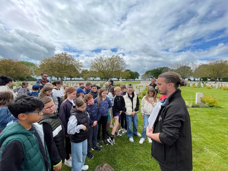The pupils of Cintheaux visiting Bretteville-sur-Laize War Cemetery with CWGF Guide Rémi Gossart
