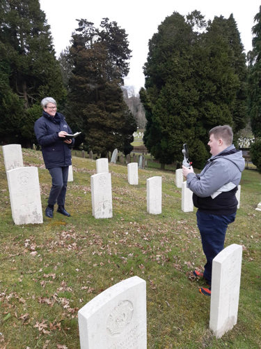 CWGC PEC Sarah Nathaniel being filmed next to CWGC headstones.