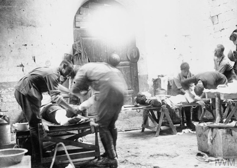 Australian doctors working on wounded soldiers in a Regimental Aid post during the First World War.