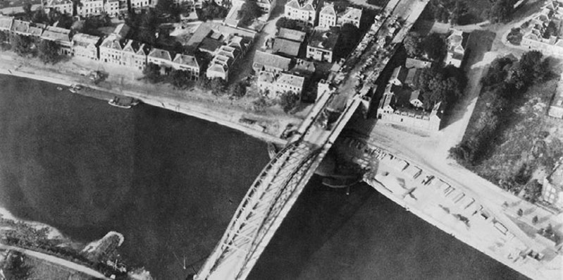 Arnhem Bridge after Operation Market Garden showing the damage donw to the bridge and surrounding buildings.