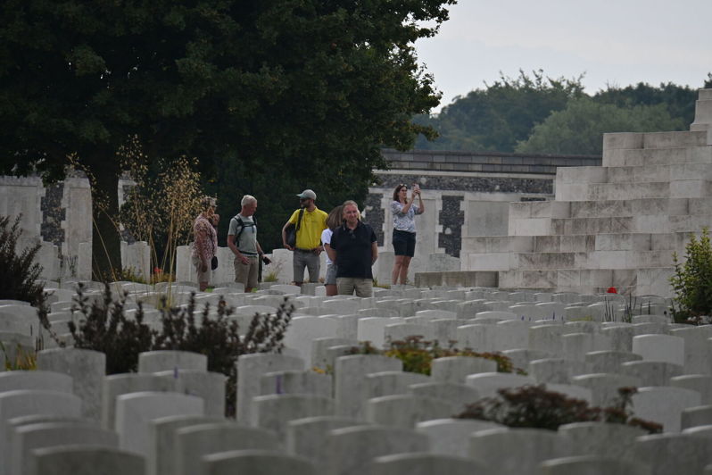 Cole Green, CWGF guide in the yellow polo shirt, guides visitors around Tyne Cot Cemetery, Belgium.