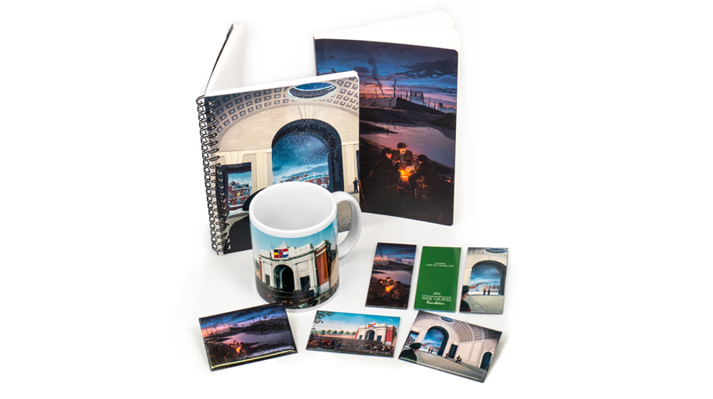 Selection of merchandise items include notebook, mug, and bookmarks, set against a white background.