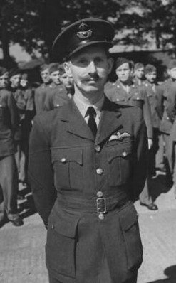 Wing Commander Harrison poses in his airman's uniform.