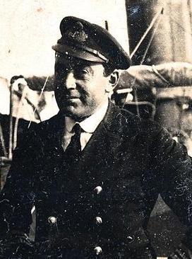 Sepia phot of Lieutenant-Commander Geoffrey Saxton White in his naval uniform.