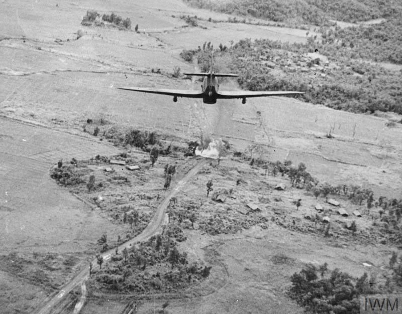 An RAF hurricane attacks Japanese forces in a strafing run.