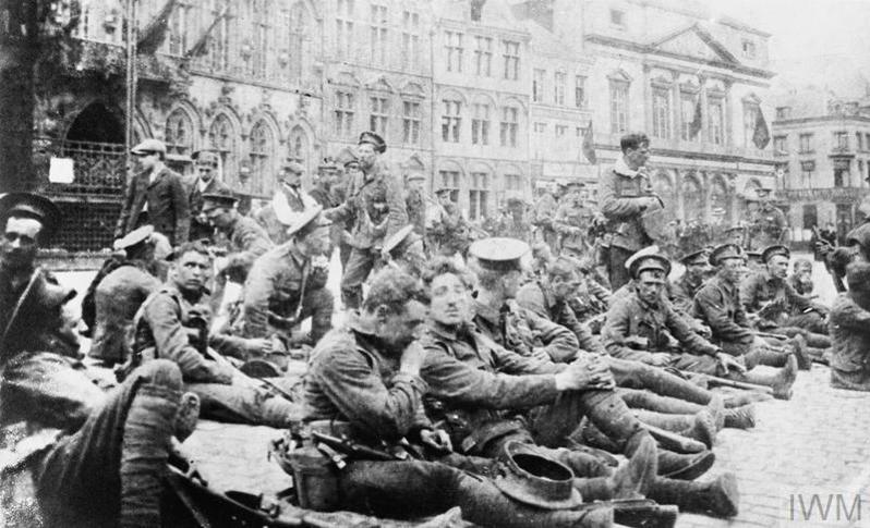 Troops of the A Company, 4th Battalion, Royal Fusiliers (7th Brigade, 3rd Division) resting in the Grand Place, Mons, August 1914.