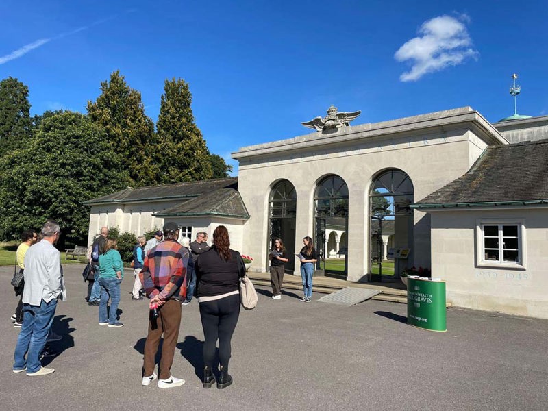 Student guides giving a talk to visitors to the Runnymede Memorial.